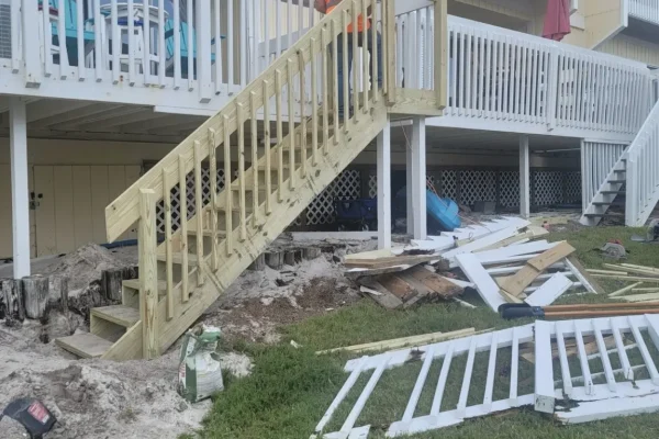 New pressure-treated deck stairs and railings under construction