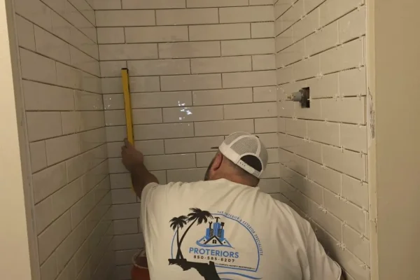 Vertical subway tile shower installation in progress